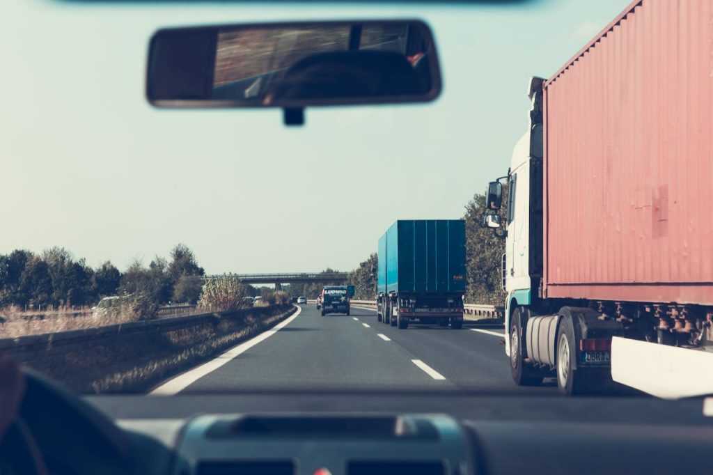 pexels-photo-172074 View through rearview mirror of trucks on a German highway, driving towards Bamberg.